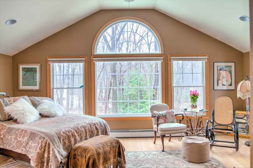 24 Hall Road Chelmsford, MA 01824 - Photo 3 of 30 a bedroom with a bed and a large window