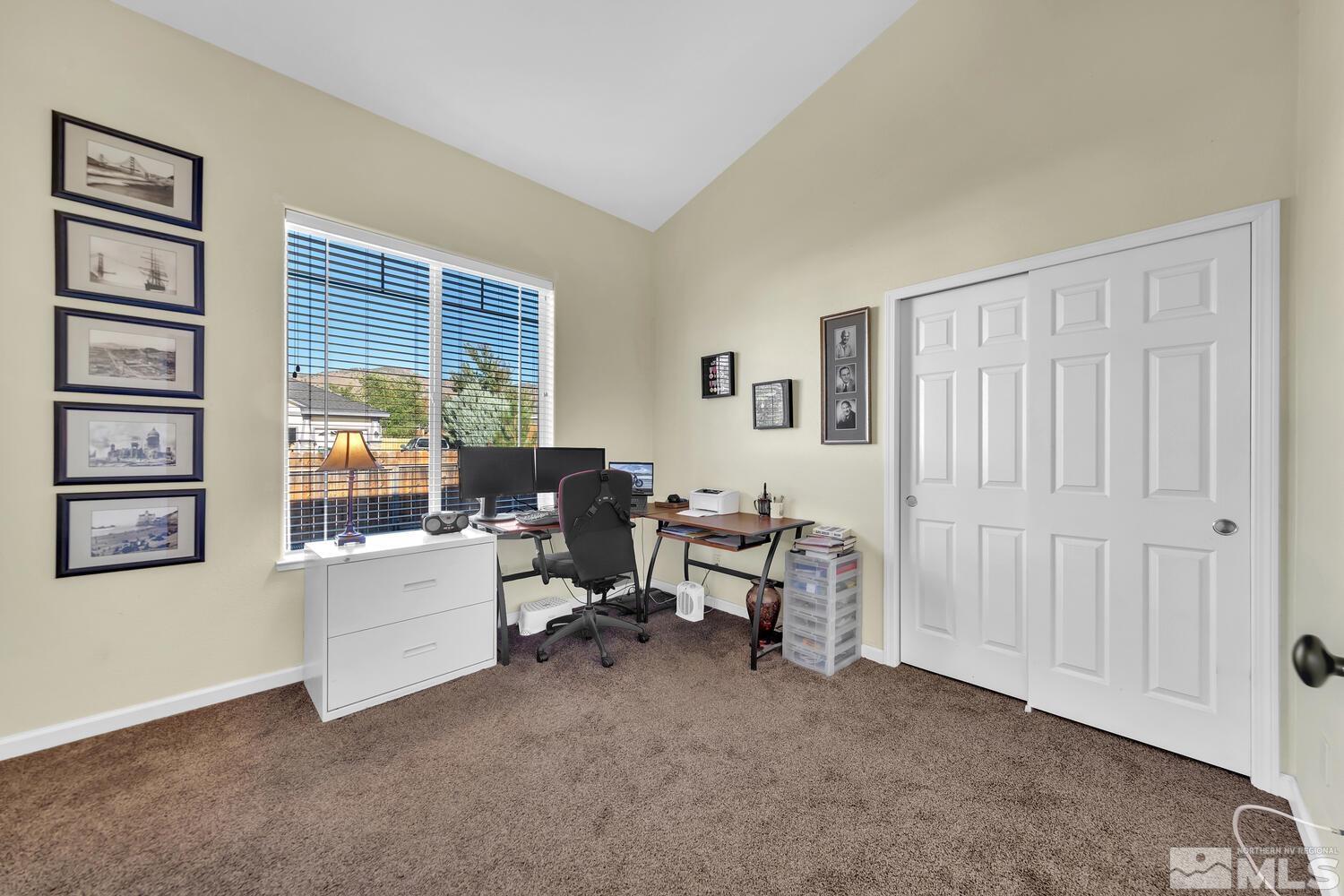740 Silver Run Drive Reno, NV 89521 - Photo 23 of 36 a view of a livingroom with workspace and a window