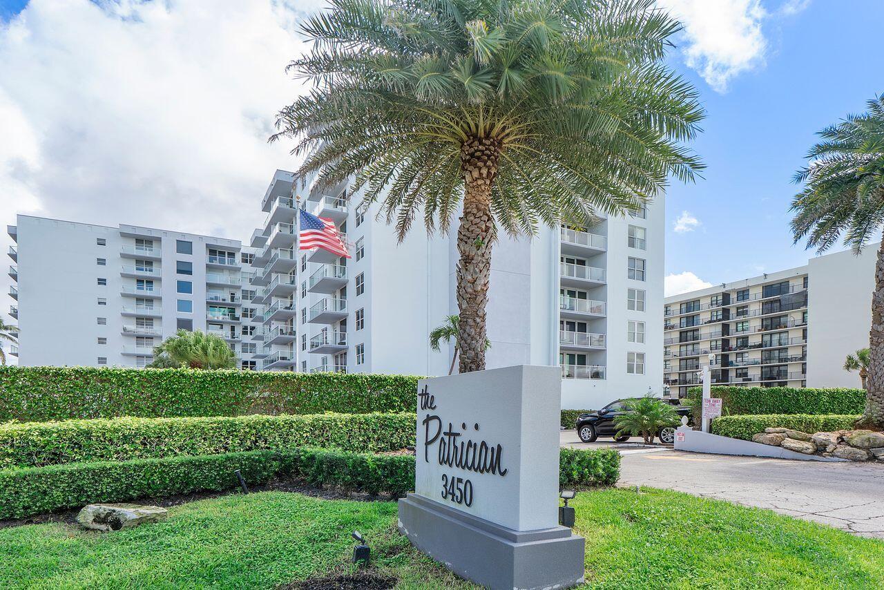 3450 South Ocean Boulevard, Unit 118 Palm Beach, FL 33480 - Photo 1 of 39 a front view of multi story residential apartment building with yard and green space