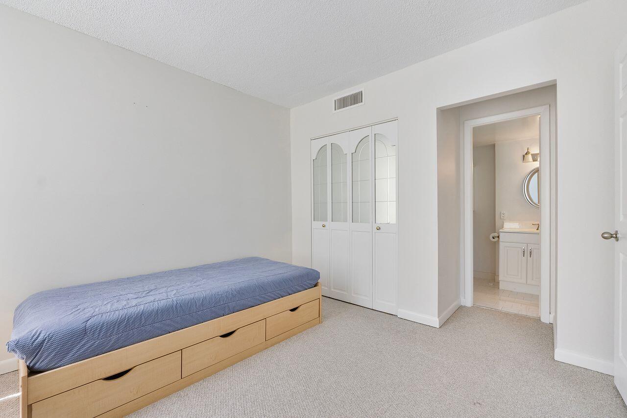 3450 South Ocean Boulevard, Unit 118 Palm Beach, FL 33480 - Photo 11 of 39 a room with a bed and a bathroom