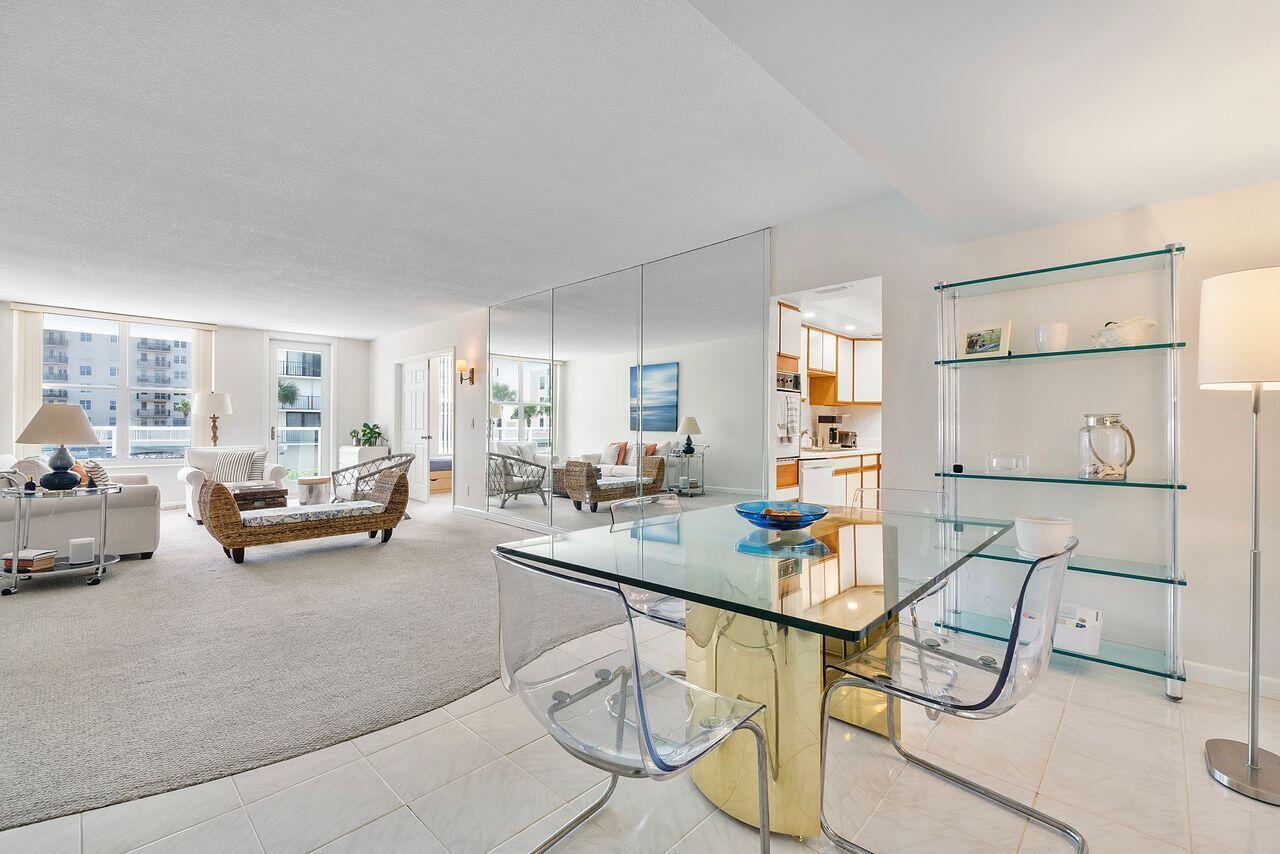 3450 South Ocean Boulevard, Unit 118 Palm Beach, FL 33480 - Photo 14 of 39 a living room with furniture and a table