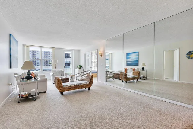a living room with furniture and a table