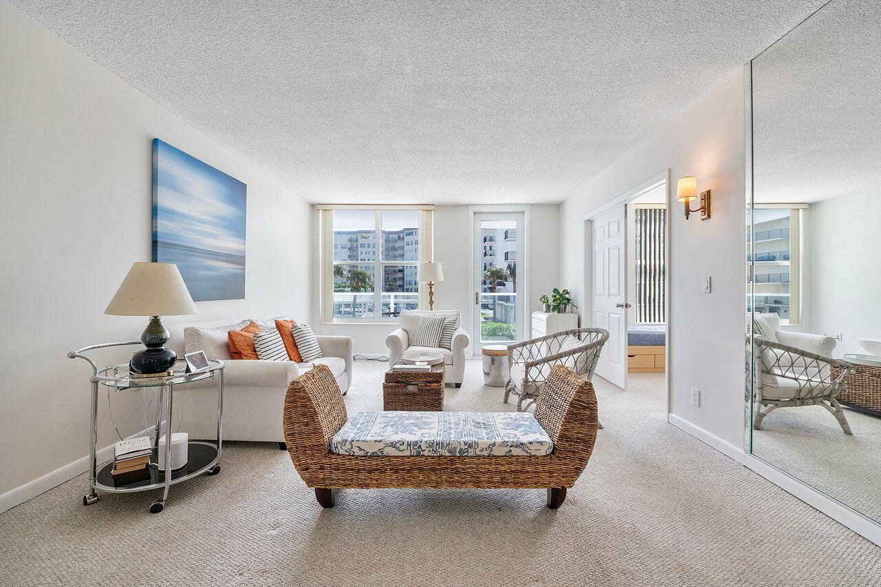 3450 South Ocean Boulevard, Unit 118 Palm Beach, FL 33480 - Photo 16 of 39 a living room with furniture and a large window