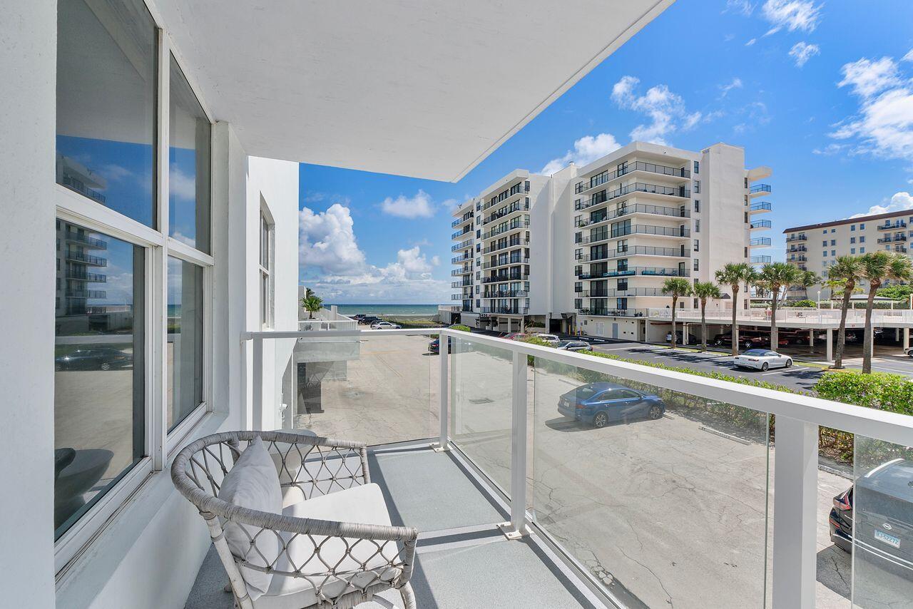 3450 South Ocean Boulevard, Unit 118 Palm Beach, FL 33480 - Photo 20 of 39 a view of a balcony with chairs