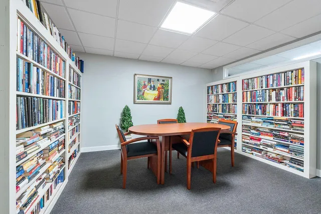 a view of a workspace with furniture and toys