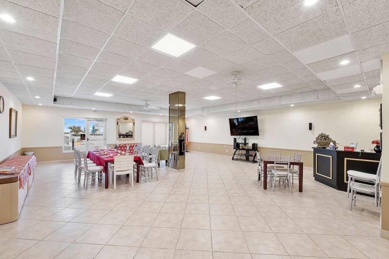 3450 South Ocean Boulevard, Unit 118 Palm Beach, FL 33480 - Photo 32 of 39 a living room with furniture and a flat screen tv