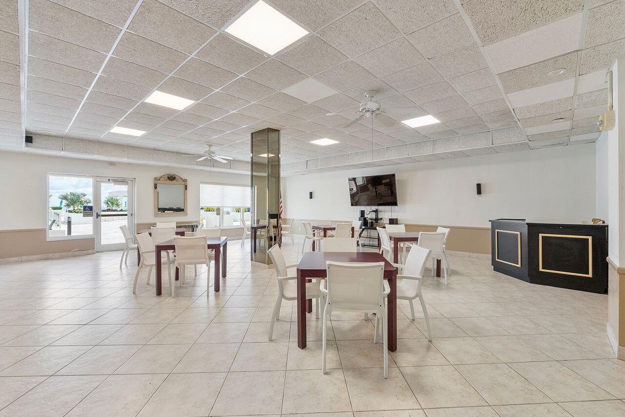 3450 South Ocean Boulevard, Unit 118 Palm Beach, FL 33480 - Photo 4 of 39 a view of a dining hall with furniture