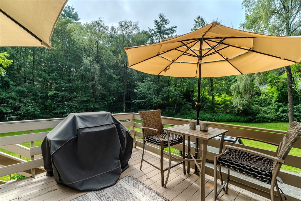 2 Gulf Road Pelham, MA 01002 - Photo 11 of 38 an outdoor sitting area with furniture and umbrella