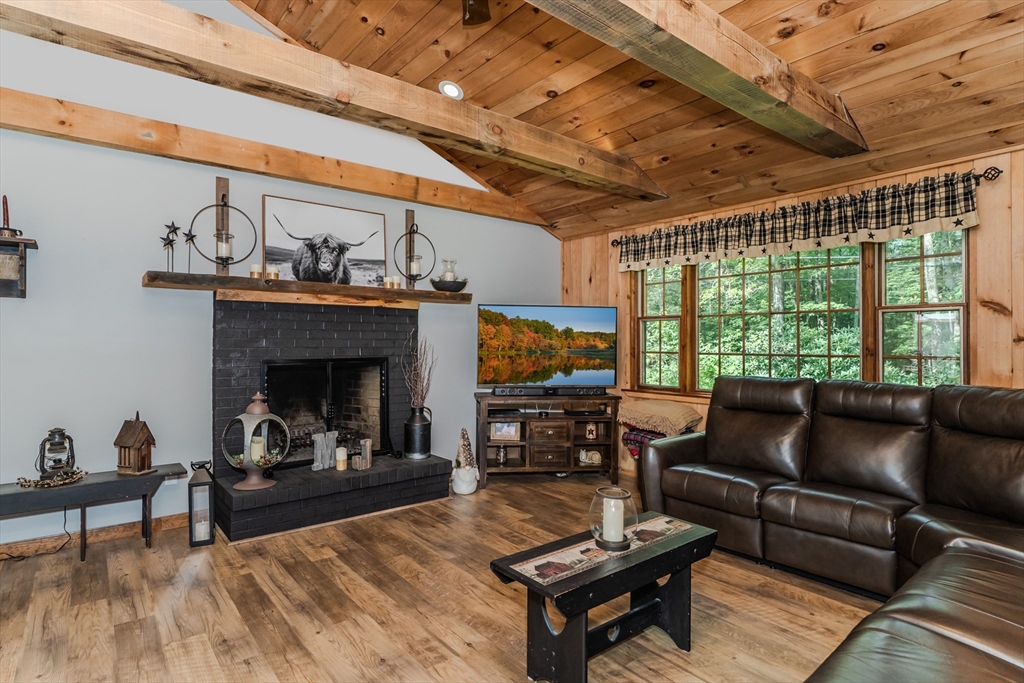 2 Gulf Road Pelham, MA 01002 - Photo 16 of 38 a living room with furniture and a fireplace