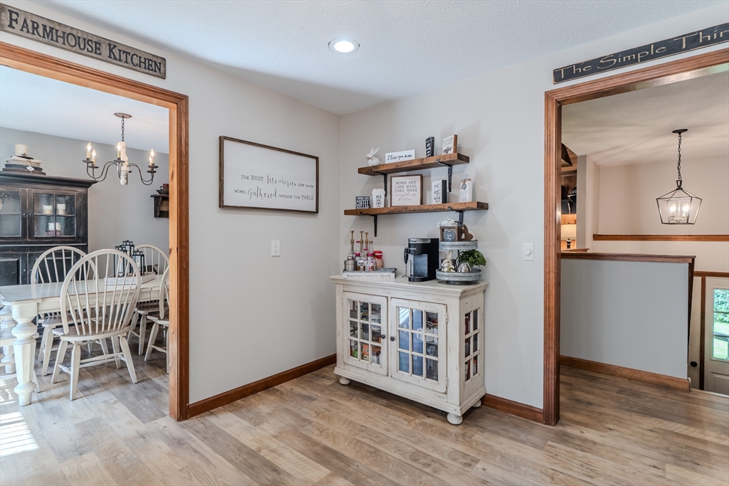 2 Gulf Road Pelham, MA 01002 - Photo 24 of 38 a open kitchen with stainless steel appliances granite countertop a table and chairs
