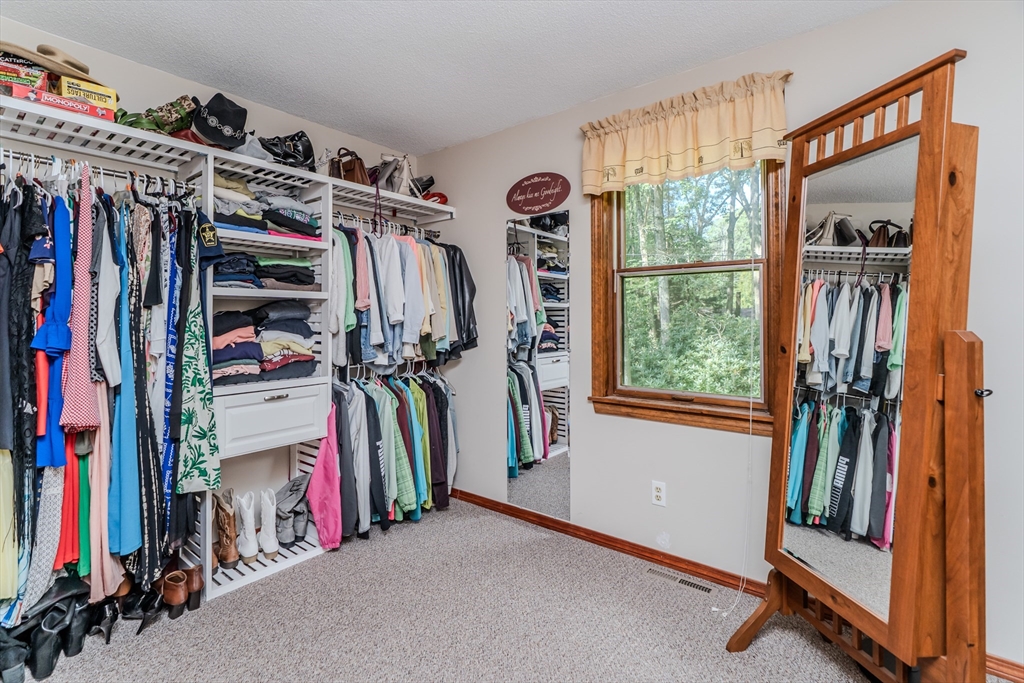 2 Gulf Road Pelham, MA 01002 - Photo 31 of 38 a view of walk in closet with clothes and shoes