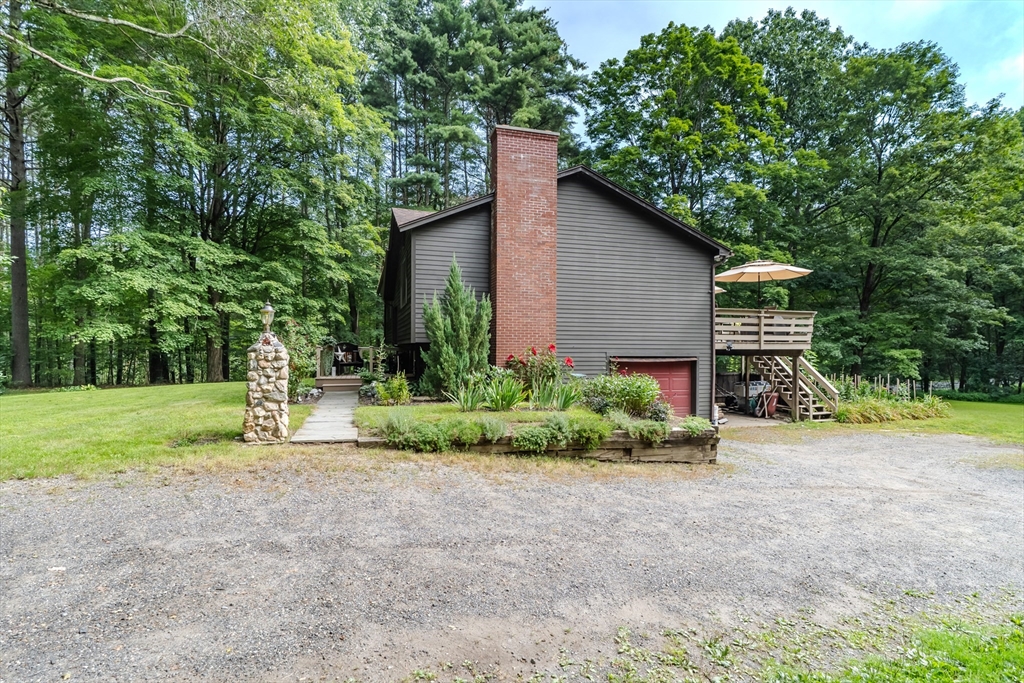 2 Gulf Road Pelham, MA 01002 - Photo 5 of 38 a front view of house with yard and green space