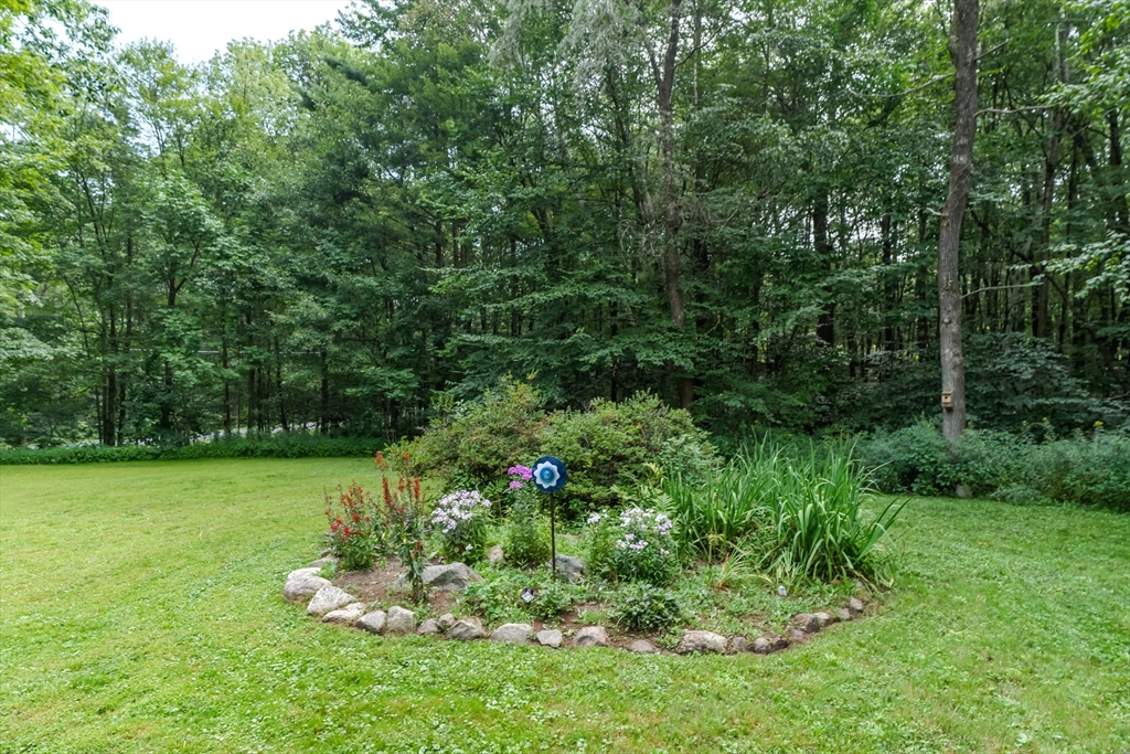 2 Gulf Road Pelham, MA 01002 - Photo 7 of 38 a view of a garden with a fountain