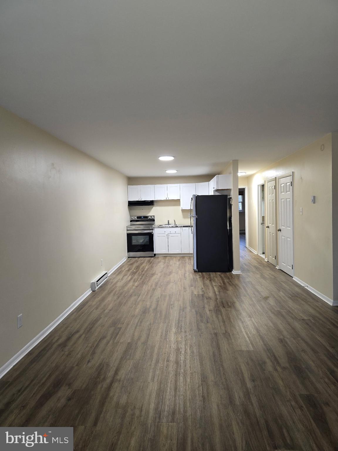 94 Governor Printz Boulevard, Unit 8 Claymont, DE 19703 - Photo 15 of 17 a view of empty room with wooden floor