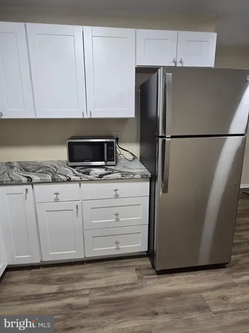 a kitchen with appliances and cabinets