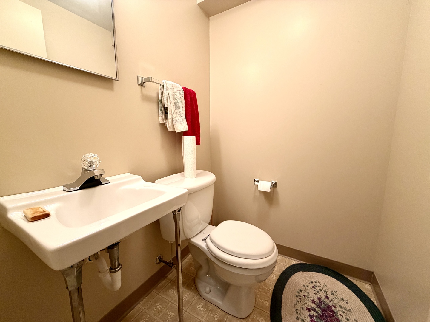 1211 Monroe Street Pecatonica, IL 61063 - Photo 17 of 19 a bathroom with a sink a toilet and a mirror