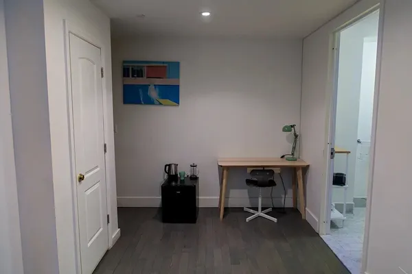 a view of a workspace with furniture