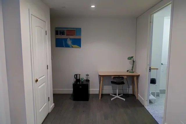 a view of a workspace with furniture