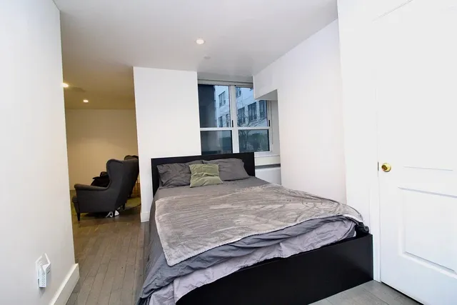 a bedroom with a bed and furniture