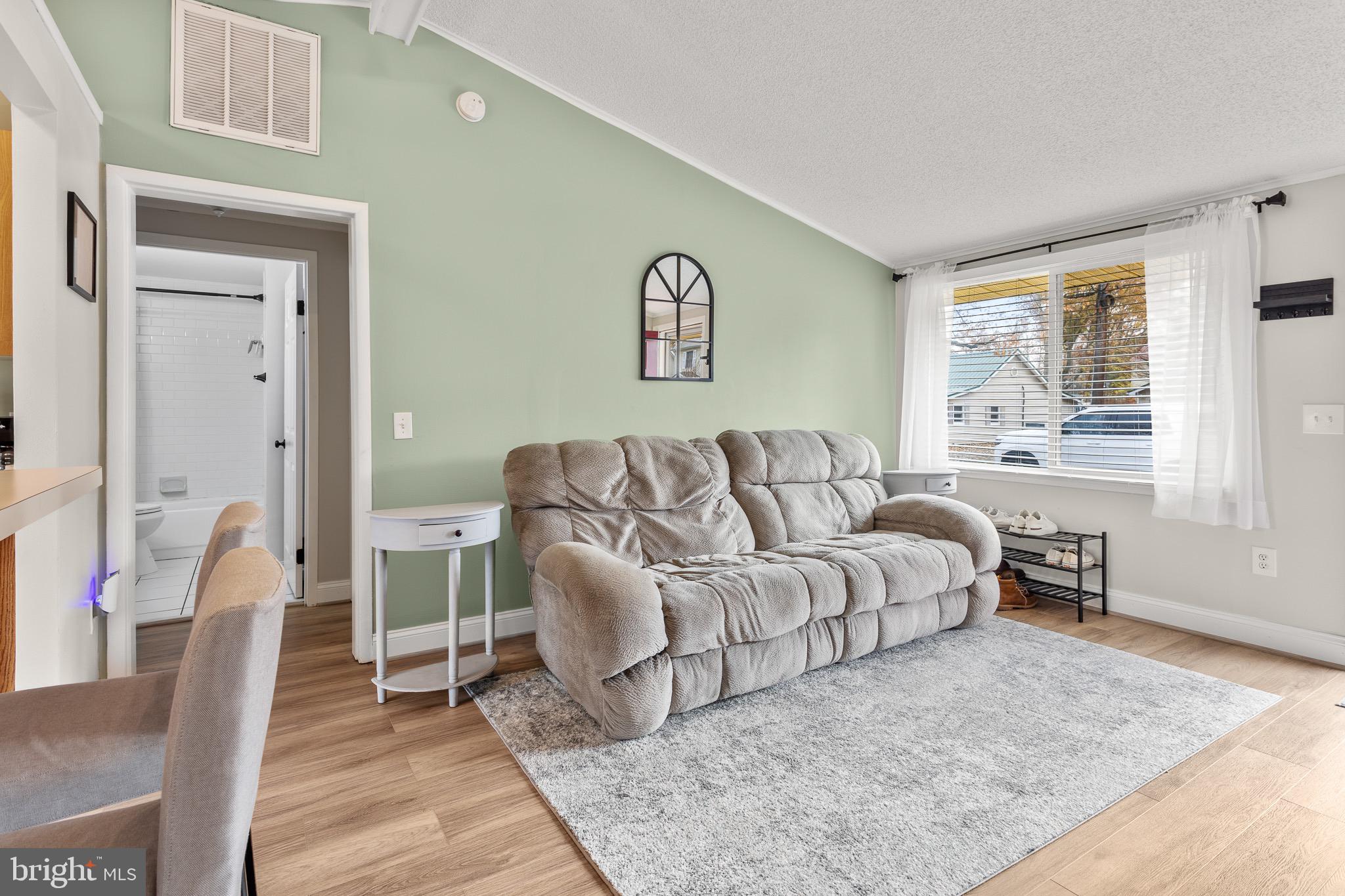 4912 Beech Street Shady Side, MD 20764 - Photo 15 of 42 a living room with furniture and a rug