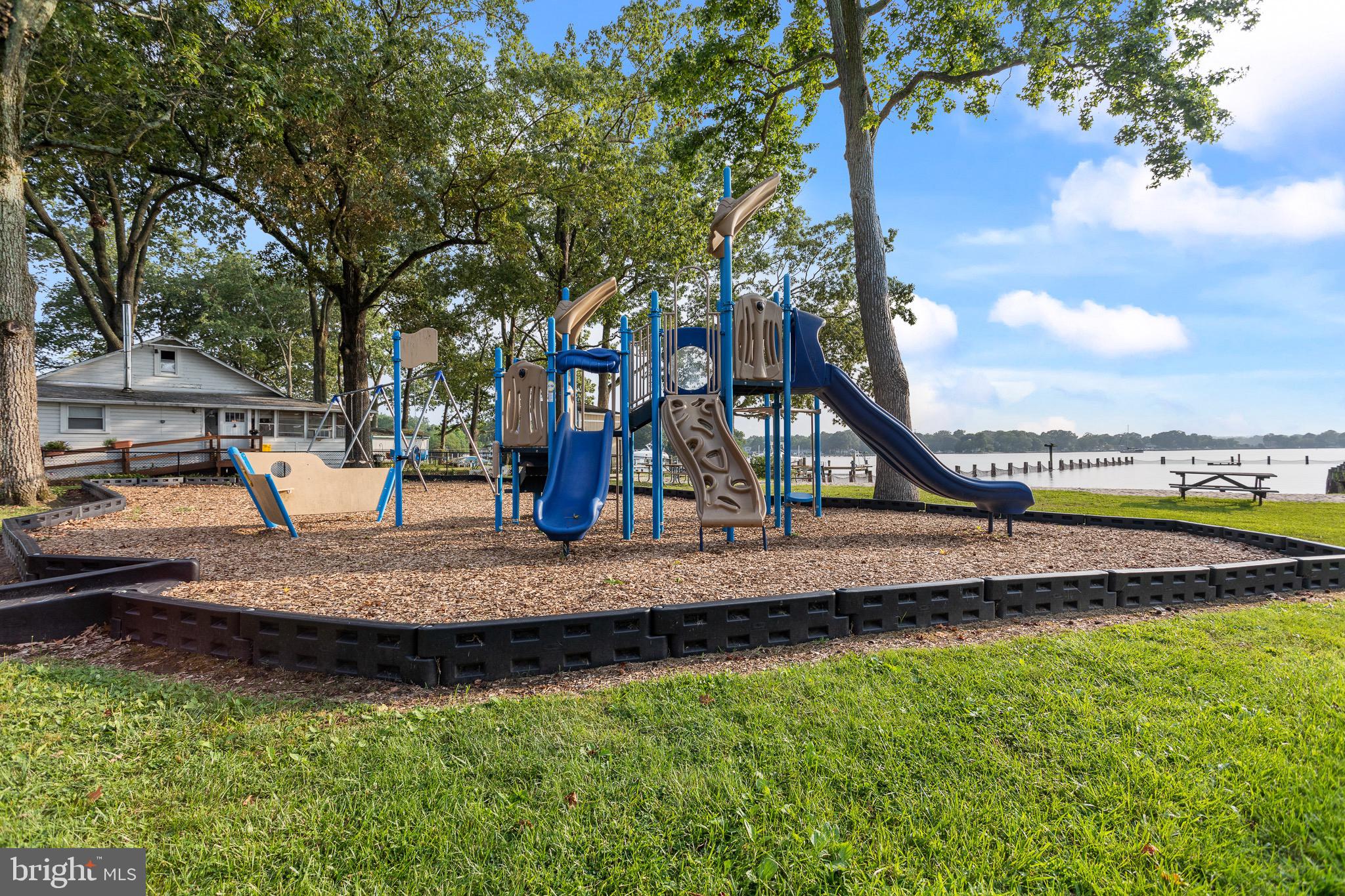 4912 Beech Street Shady Side, MD 20764 - Photo 29 of 42 a view of a wooden deck and lake view