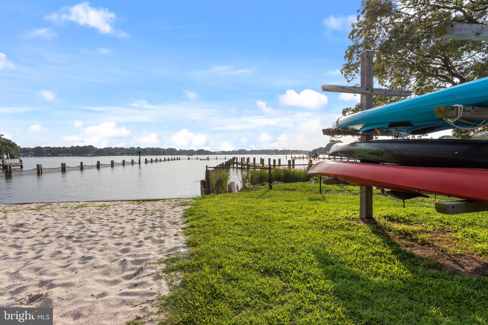 4912 Beech Street Shady Side, MD 20764 - Photo 31 of 42 a garden with a bench in the back yard