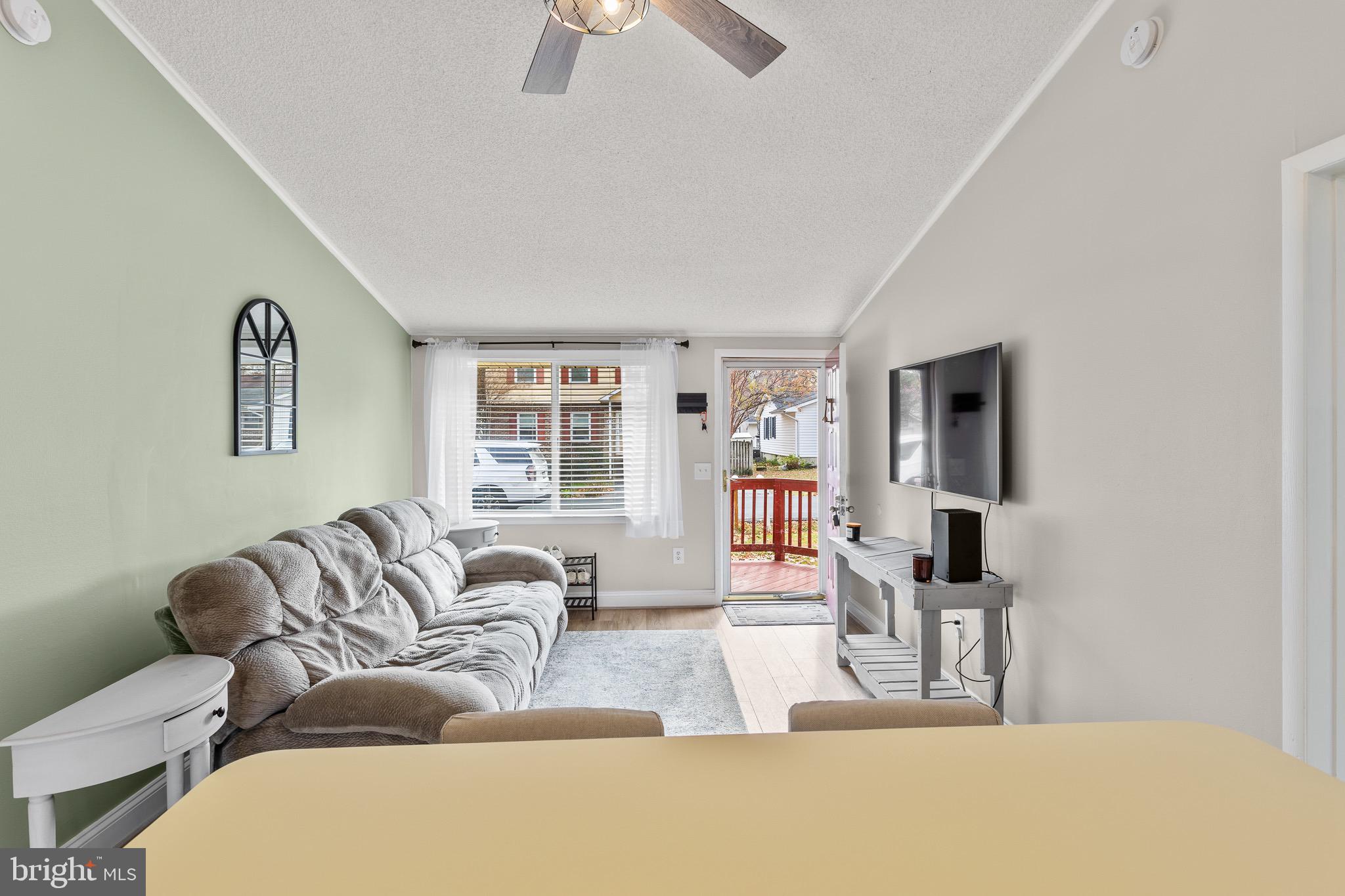 4912 Beech Street Shady Side, MD 20764 - Photo 8 of 42 a living room with furniture and a wooden floor