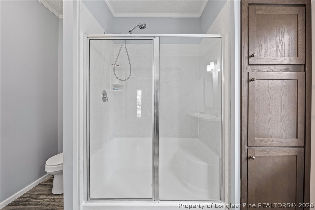 2252 Old Stage Road South Erwin, NC 28339 - Photo 32 of 47 a bathroom with a glass shower door