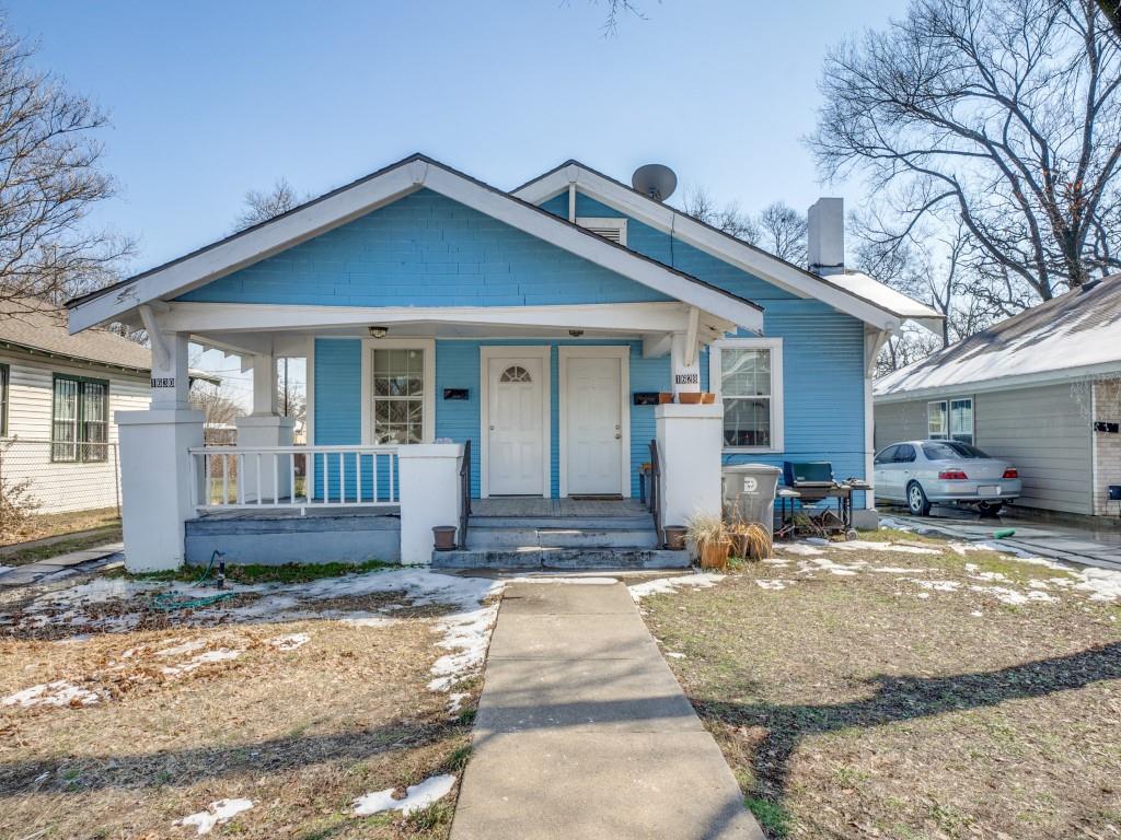 1628 Poplar Street Dallas, TX 75215 - Photo 1 of 20 a front view of a house with garden