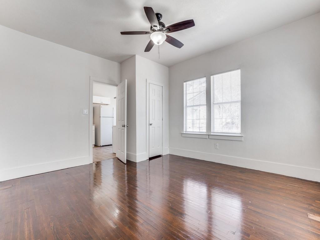 1628 Poplar Street Dallas, TX 75215 - Photo 15 of 20 a view of an empty room with window and wooden floor