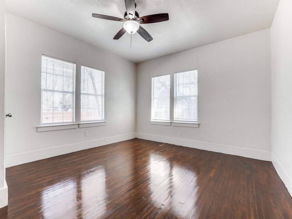 1628 Poplar Street Dallas, TX 75215 - Photo 16 of 20 a view of empty room with wooden floor and fan