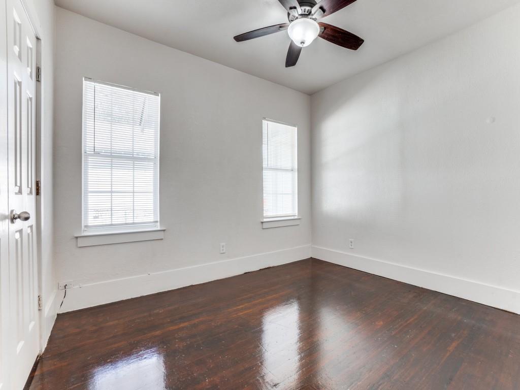 1628 Poplar Street Dallas, TX 75215 - Photo 18 of 20 a view of an empty room with wooden floor and a window