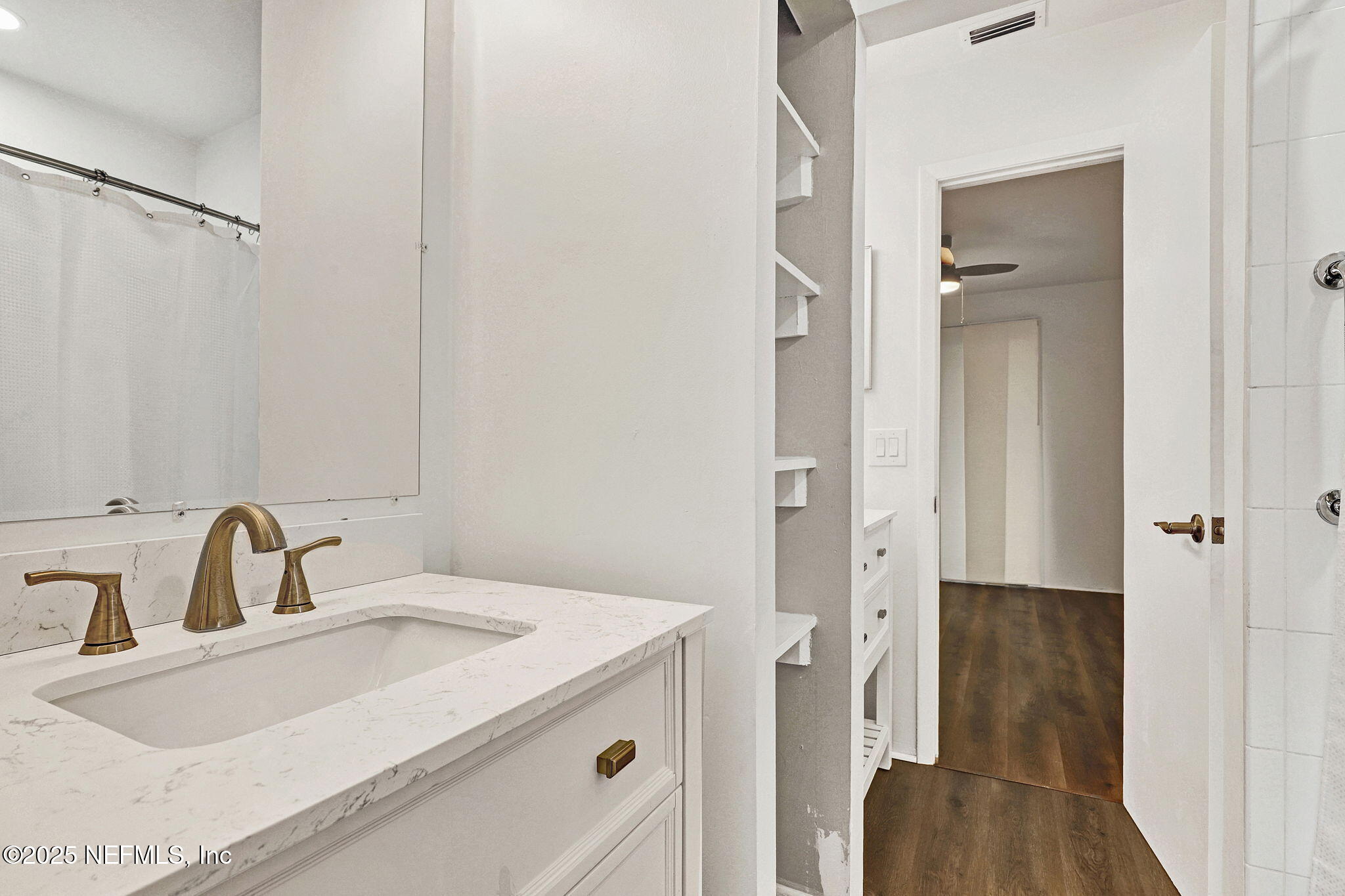 2300 Twelve Oaks Drive, Unit B4 Orange Park, FL 32065 - Photo 12 of 15 a bathroom with a sink and mirror