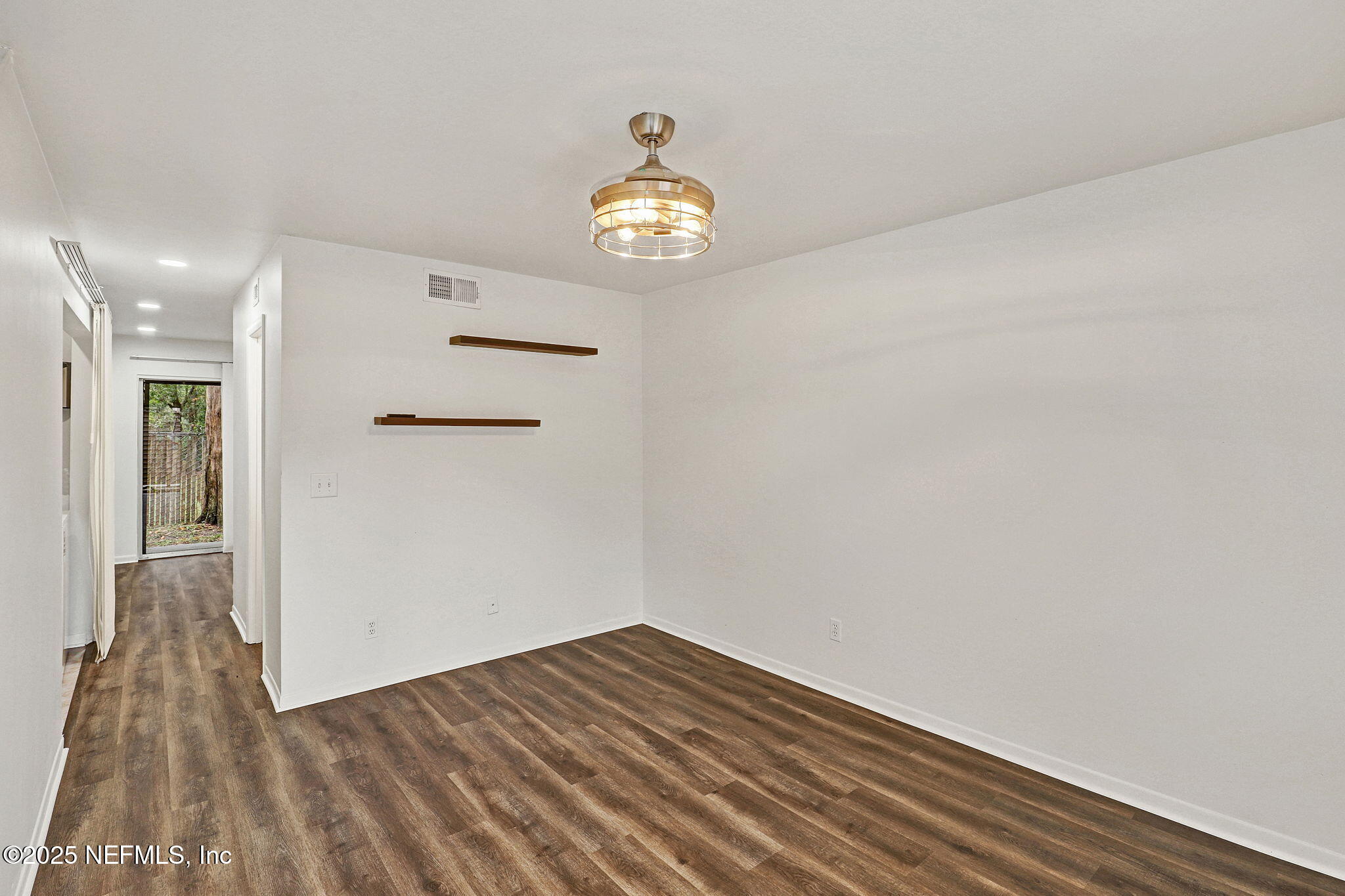 2300 Twelve Oaks Drive, Unit B4 Orange Park, FL 32065 - Photo 8 of 15 a view of empty room with wooden floor