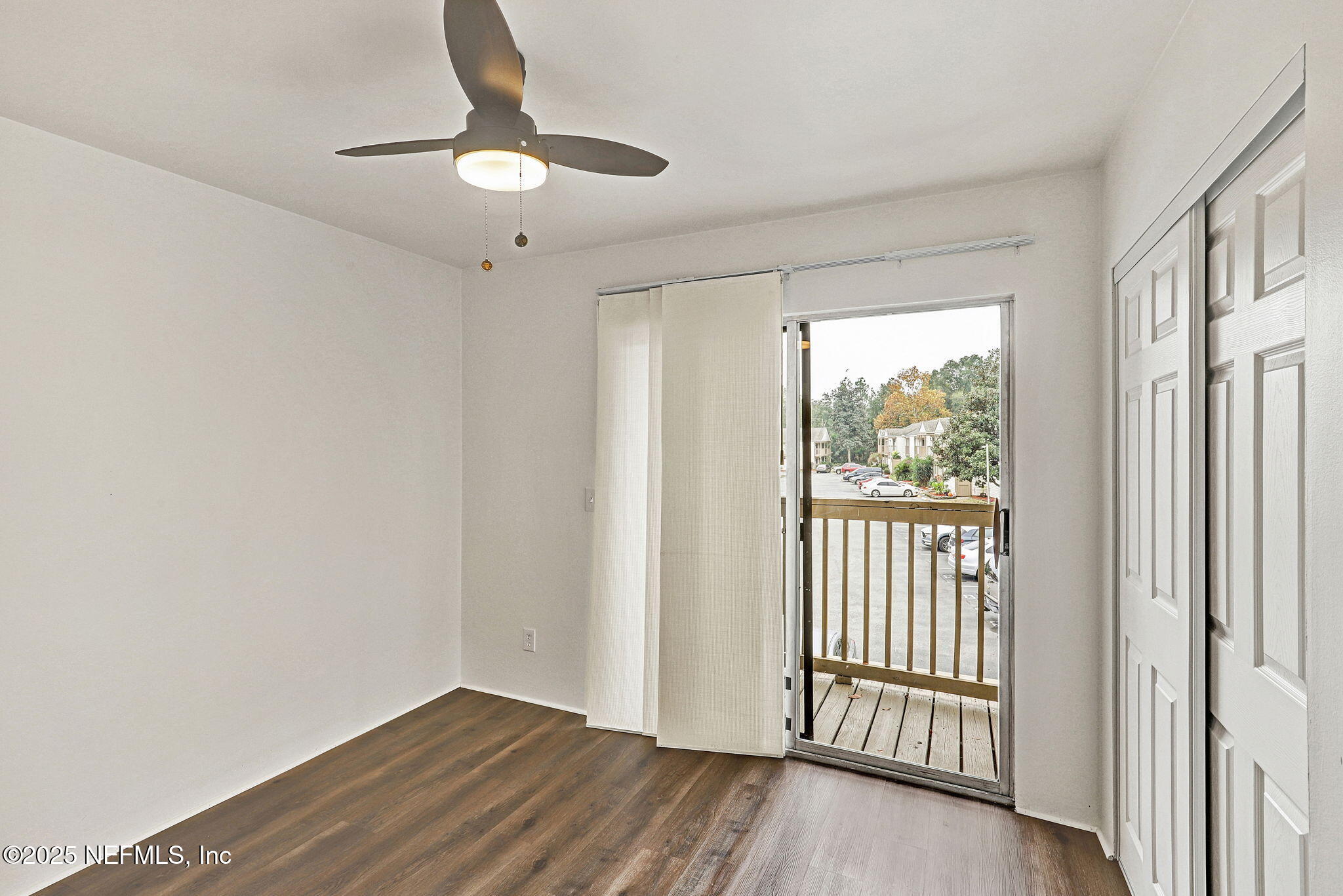 2300 Twelve Oaks Drive, Unit B4 Orange Park, FL 32065 - Photo 10 of 15 a view of a livingroom with wooden floor and a ceiling fan