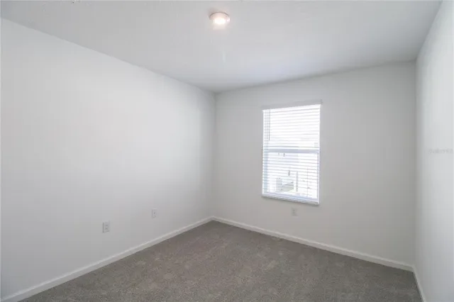 an empty room with closet area