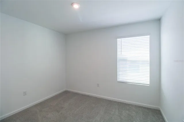 a bathroom with a granite countertop toilet a sink and a bathtub