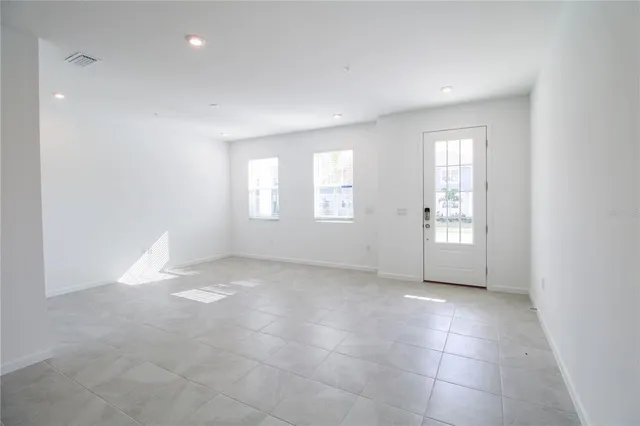 a view of empty room with windows