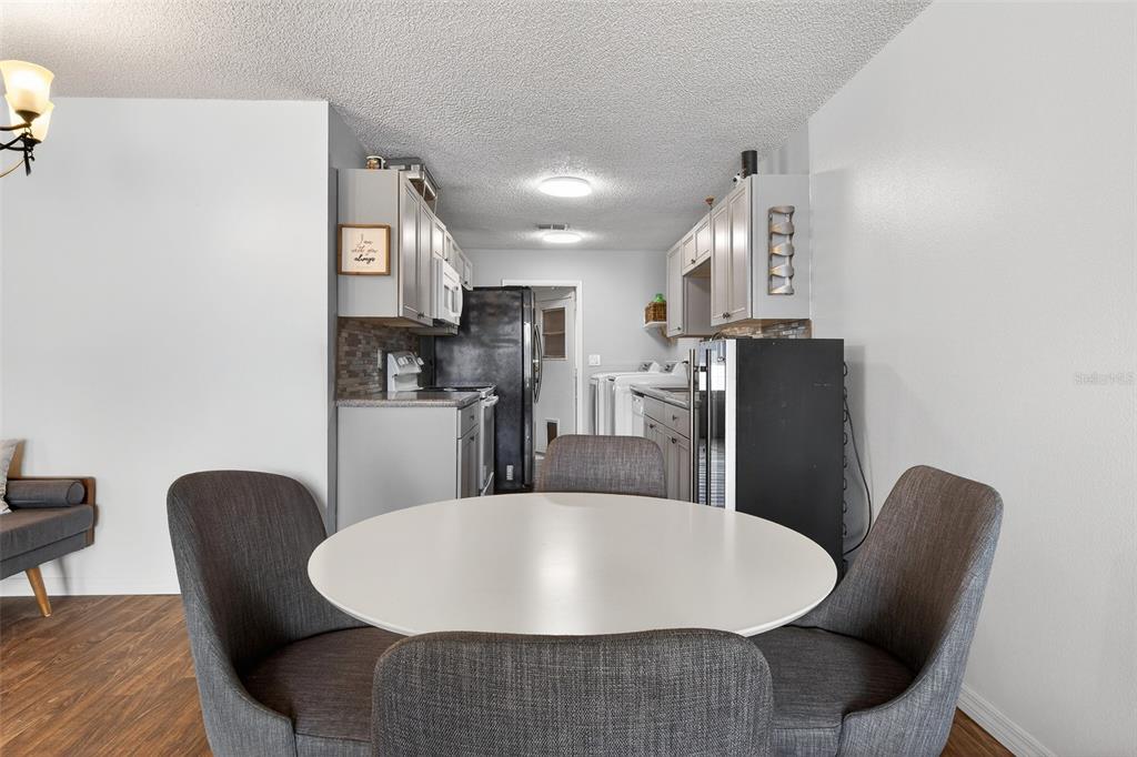 622 Ridge Terrace Winter Haven, FL 33881 - Photo 12 of 29 a large dining room with furniture and wooden floor