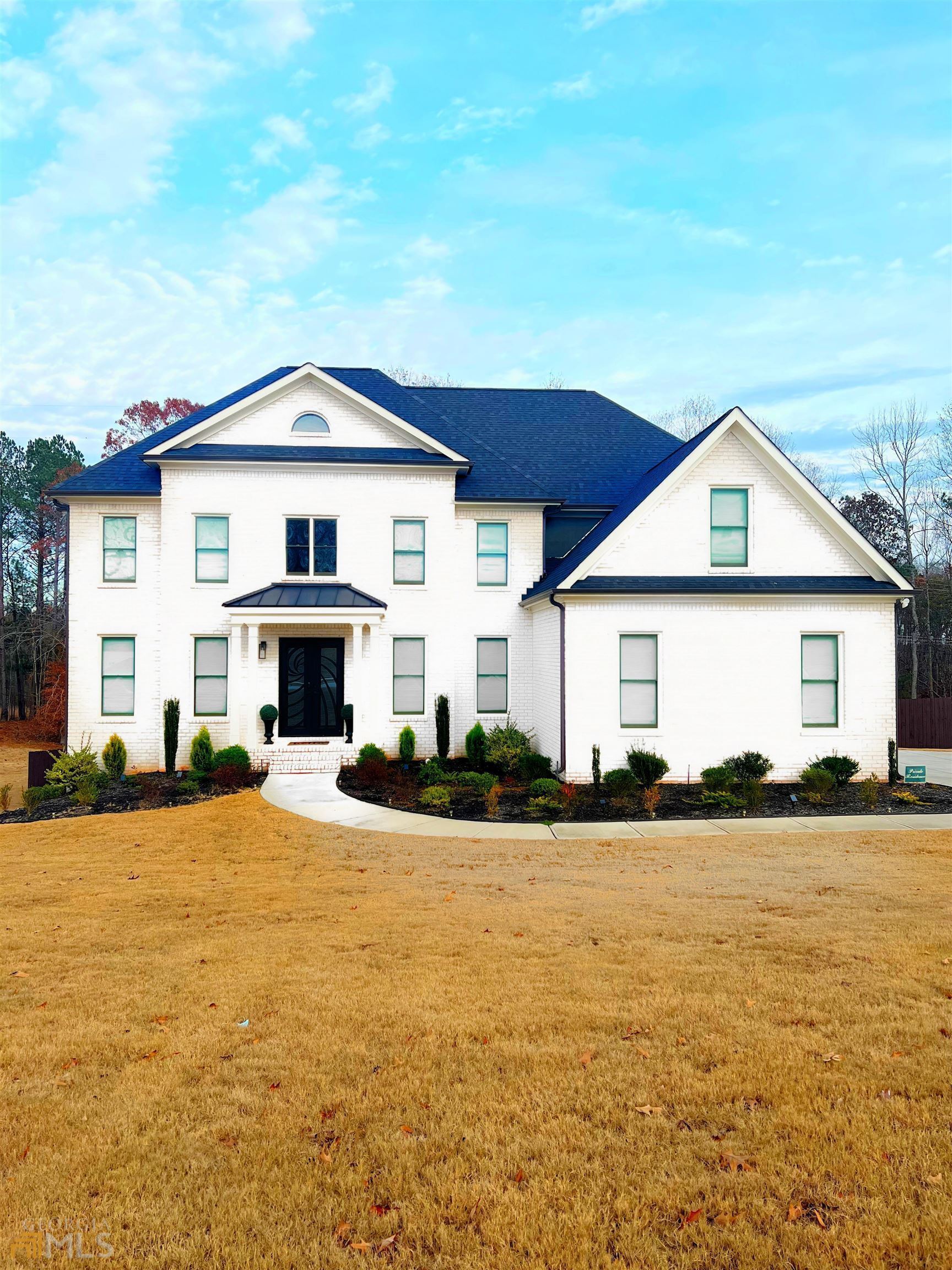 2670 Jacanar Lane Southwest Atlanta, GA 30331 - Photo 1 of 1 a front view of a house with a yard