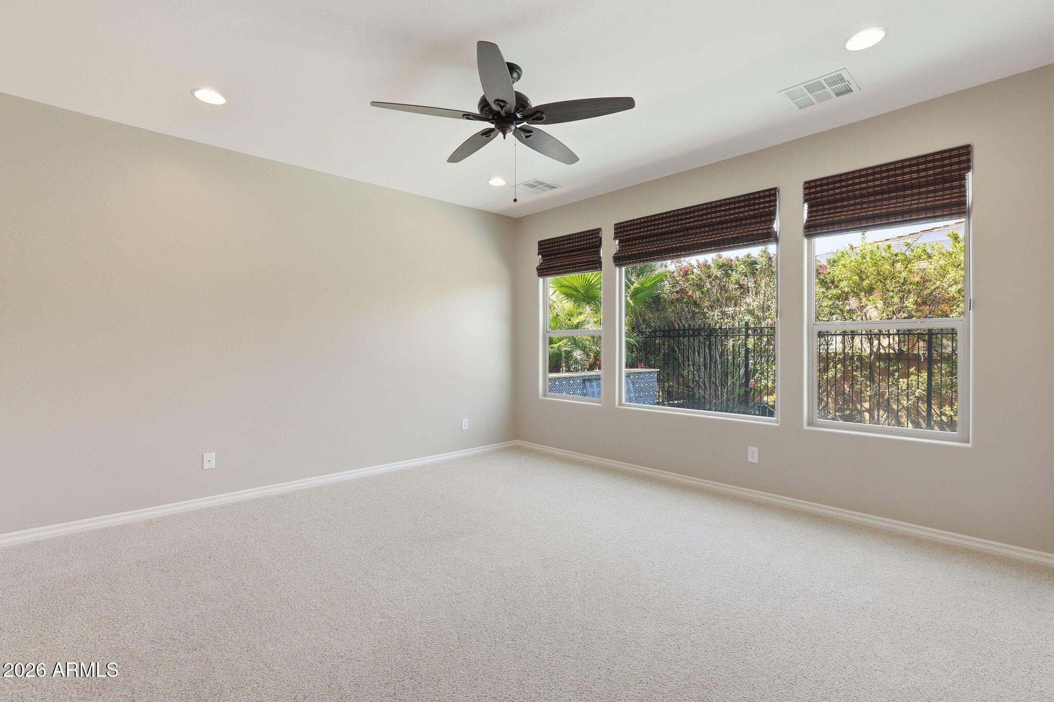 1694 East Grand Ridge Road Queen Creek, AZ 85140 - Photo 26 of 61 a view of a livingroom with a ceiling fan and window