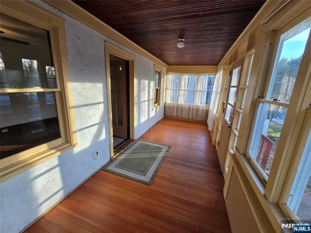 a view of entryway with stairs and wooden floor
