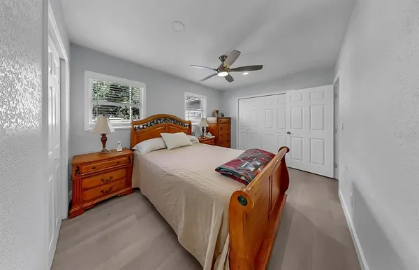 a bed room with a bed and a chandelier