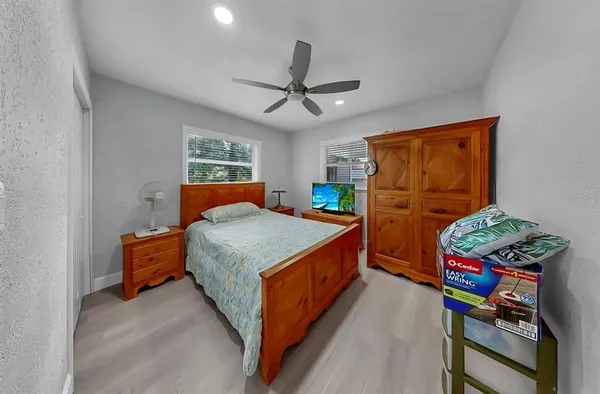 a bedroom with bed and a window