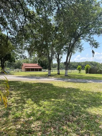 a car parked in front of a white house