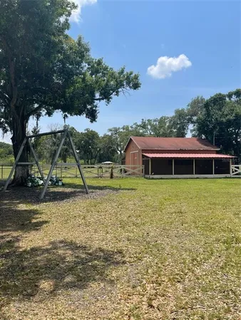 a view of a street with potted plants