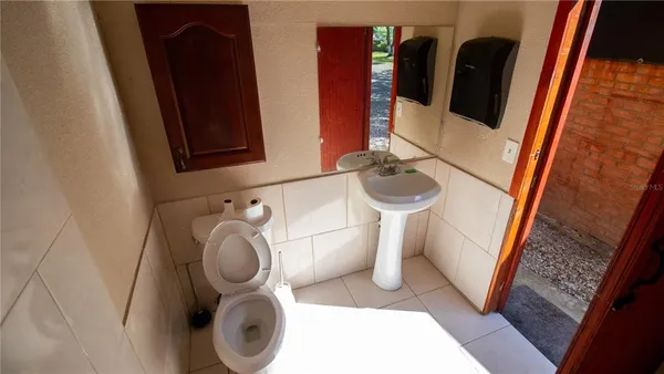 a view of backyard with outdoor seating and plants