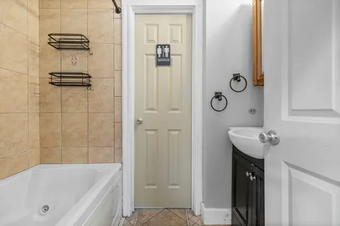 a bathroom with a bathtub and shower