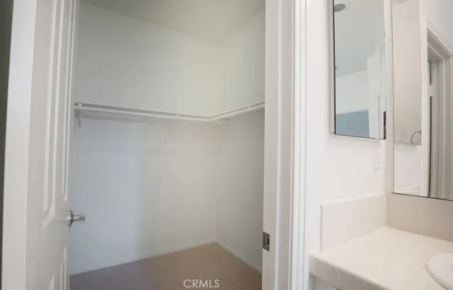 a bathroom with a bathtub shower sink vanity and toilet