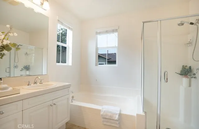 a view of a bathroom with a shower and a window
